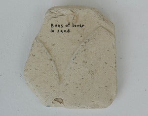 Image of Buns of Lover in Sand