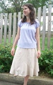 Image of Gauze-knit Raglan TopAnd tan skirt