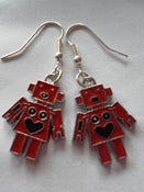 Image of Metal Red Robot Earrings with Heart Shaped Smiley Face Detail 