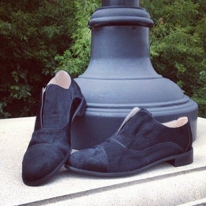 Image of black slip on pony hair oxford