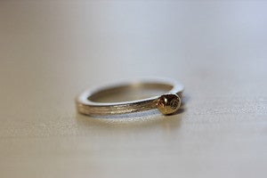 Image of single driftwood stacking ring with gold/diamond pebble