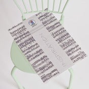 Image of Papel translúcido con notas musicales 