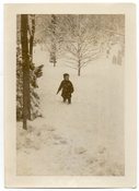 Image of BOY IN THE SNOW GRAVE YARD IN THE BACKGROUND VINTAGE SNAPSHOT PHOTO