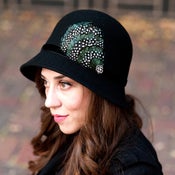 Image of Black Cloche Hat With Emerald Green and Polka Dot Feather Accent