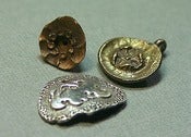 Image of 3 Charms, 3 Metals.
