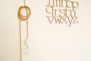 Image of *DE RETOUR* Lampe baladeuse Or Foncé tres tendance
