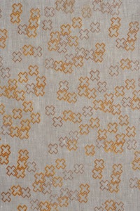 Image of cross dotty mandarin and burnt tangelo linen