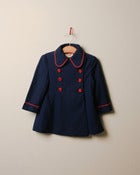 Image of c. 1980s red tipped showerproof jacket
