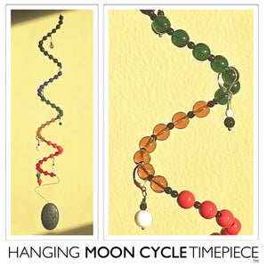 Image of Hanging Moon Cycle Timepiece | Glass | Black Vertebrae