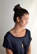 Image of 'naname' brass earrings round
