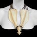 Image of Mink Skull and Canine Scapula Necklace