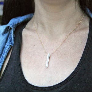 Image of crystal quartz on chain necklace