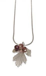 Image of Hawthorn pendant with cluster of tourmalines and garnets