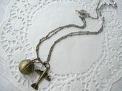 Image of Antique Brass Plane & Globe Necklace