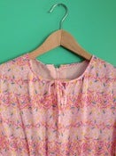 Image of Pink confetti print dress.