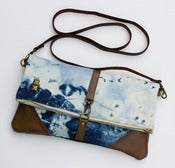 Image of hand bleached denim foldover bag with removable leather strap (c)