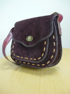 Image of heavy brown suede saddlebag handbag