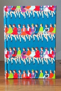 Image of Row of Dancers Turquoise Notebook