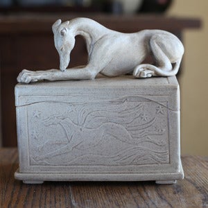 Image of Speckled box with Greyhound on top