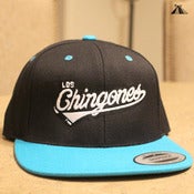 Image of Los Chingones snapback (black top/teal brim)
