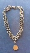 Image of Bronze double chain w coin