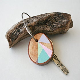 Image of hand painted Pine wood keychains by Nane Handmade