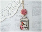 Image of Long Gold and Wooden Bird in Birdcage Necklace with Pink Flower